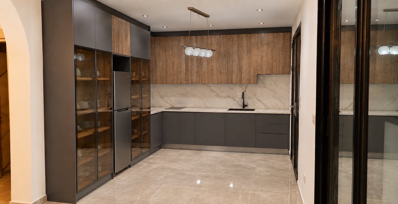 Grey and wood kitchen with a tall glass-front display cabinet
